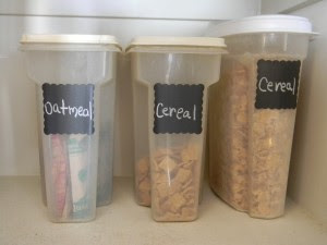 Cereal in plastic containers with chalkboard labels.