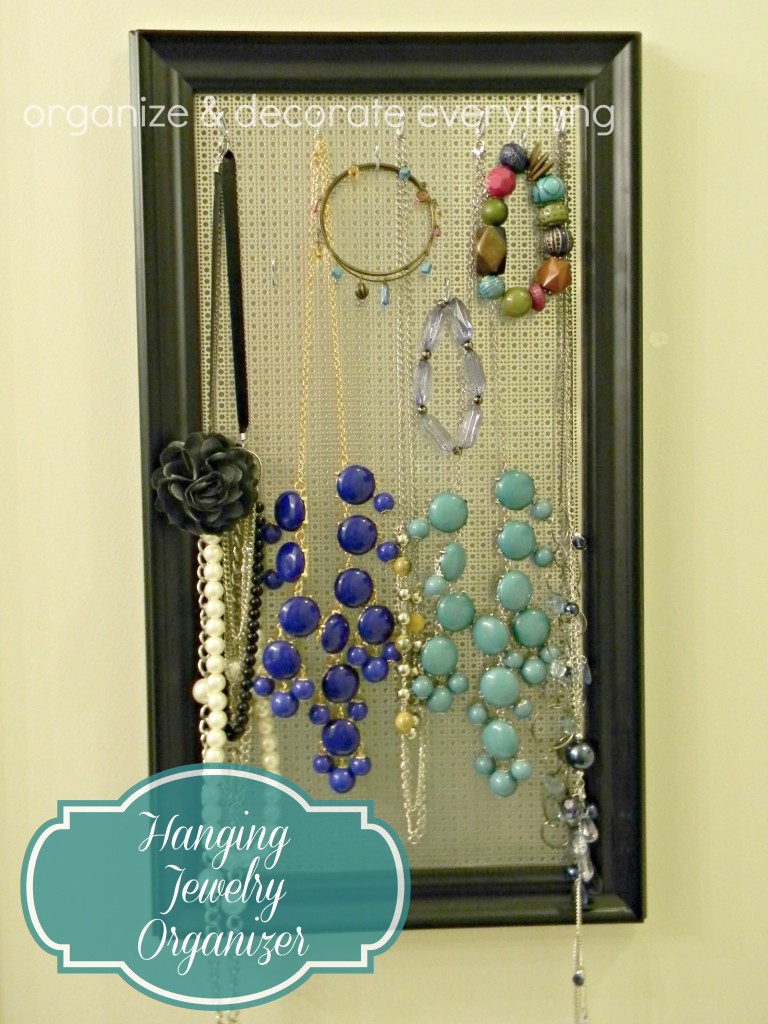 Organize and decorate everything. Hanging jewelry organizers. Chunky beaded necklaces hanging on organizer made with a decorative metal sheet and a frame.