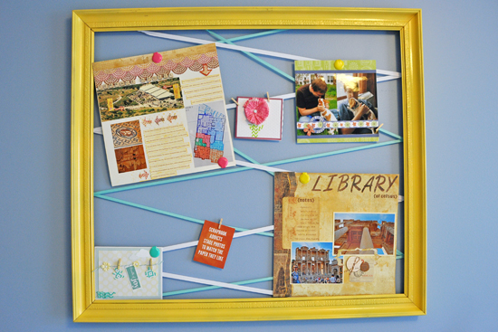 Repurposed frame painted gold with tethered ribbons to hold photos, greetings and postcards. 