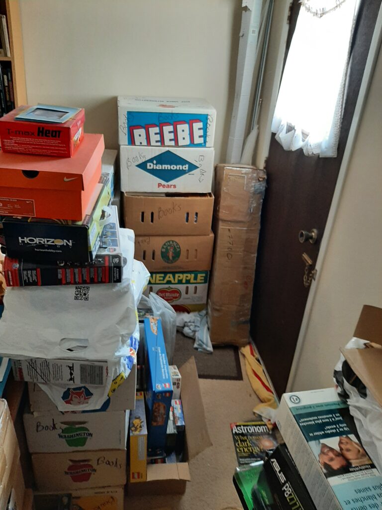 Main bedroom near door before decluttering.
