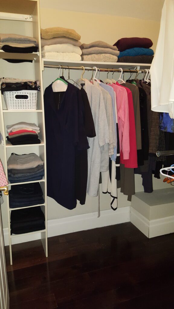 Organized closet after decluttering.