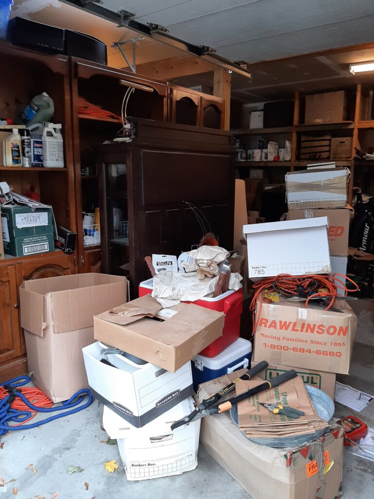 Left side of cluttered garage before decluttering.