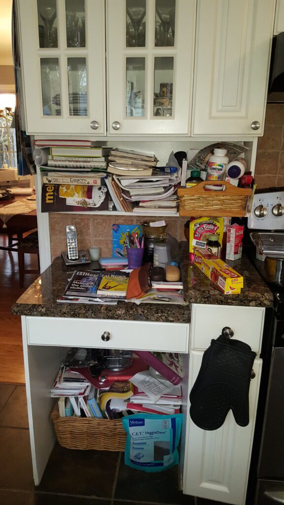 Cluttered kitchen desk.