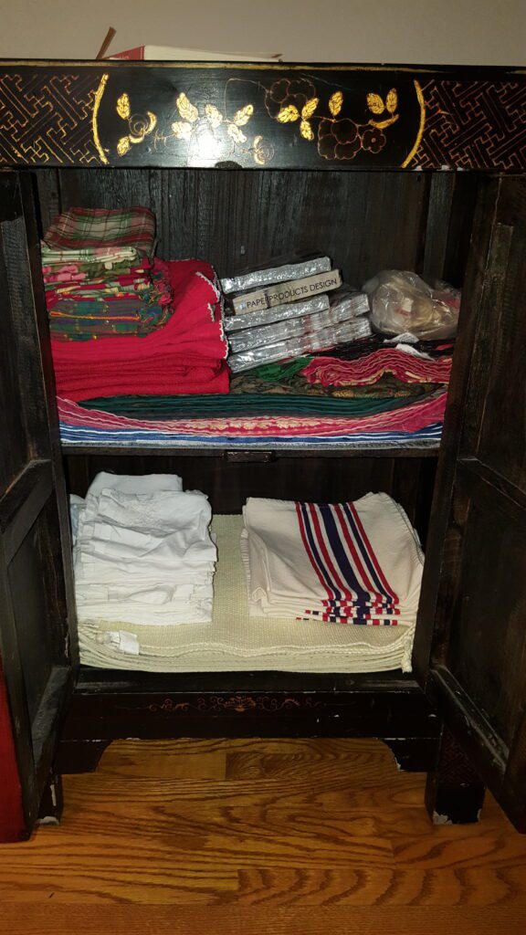 Decluttered and organized linen cabinet.