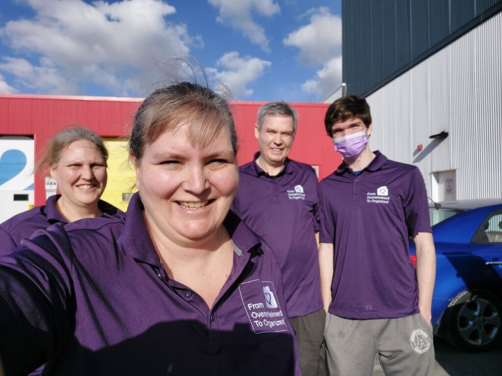 From overwhelmed to organized team in purple shirts at storage facilities. 