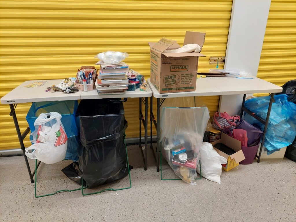 Two folding tables with garbage bags set up underneath set us as a sorting station. 